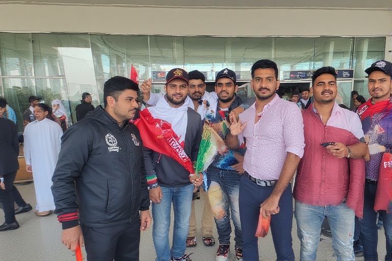 International cricket fans with flags arriving at UAE airport for Asia Cup 2025